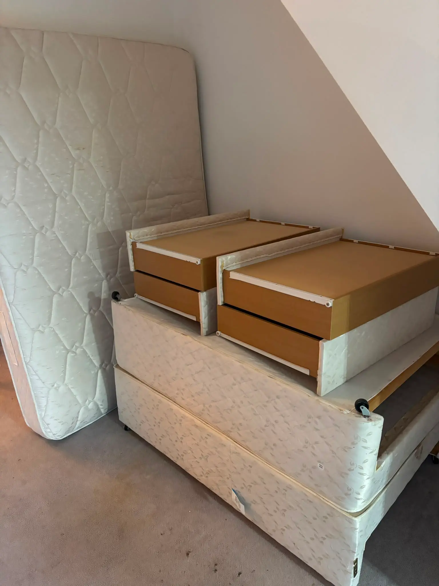 Mattress and boxed household items ready to be removed during a property clearance.