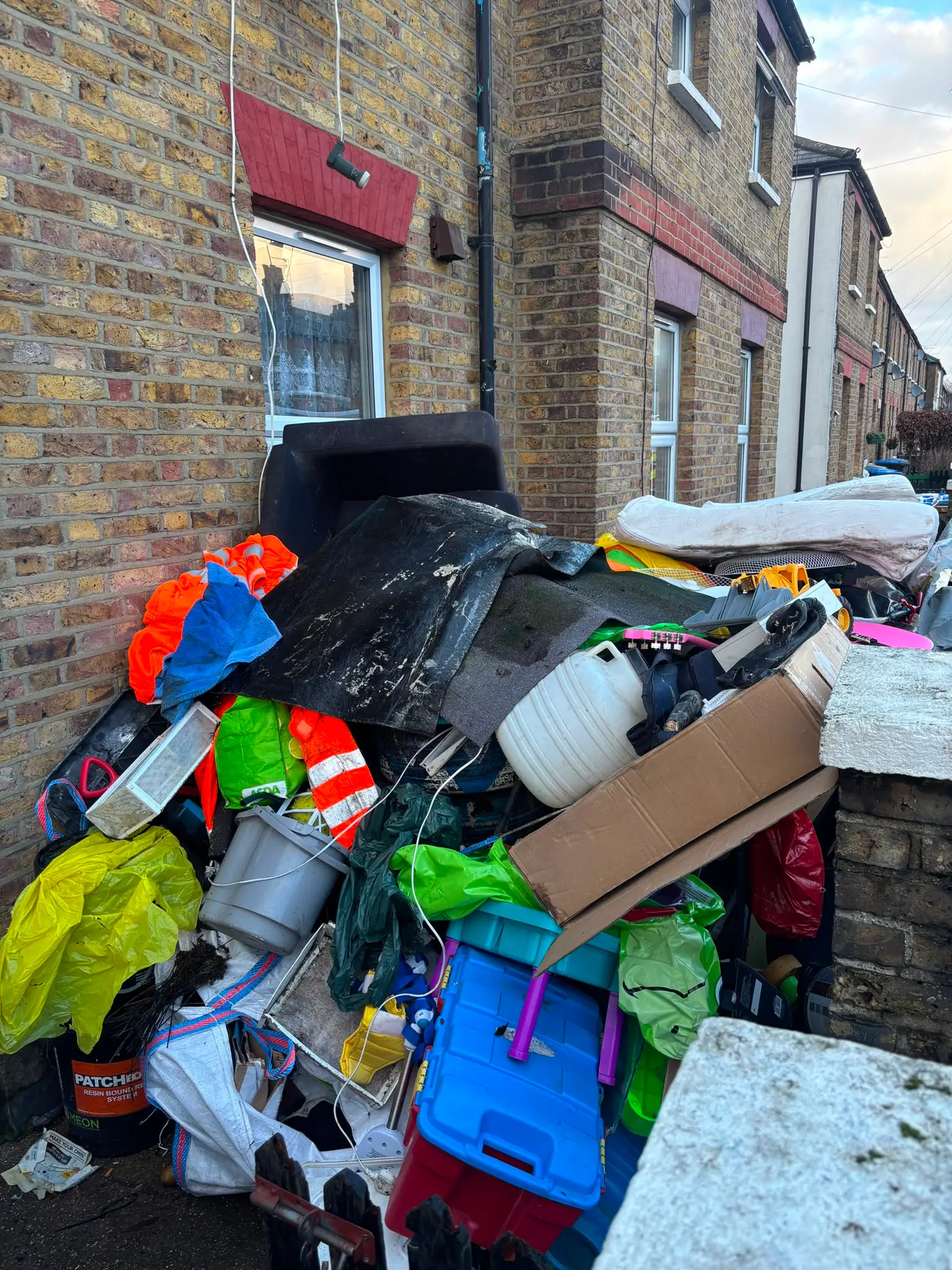 Mixed household and outdoor waste gathered for rubbish clearance.