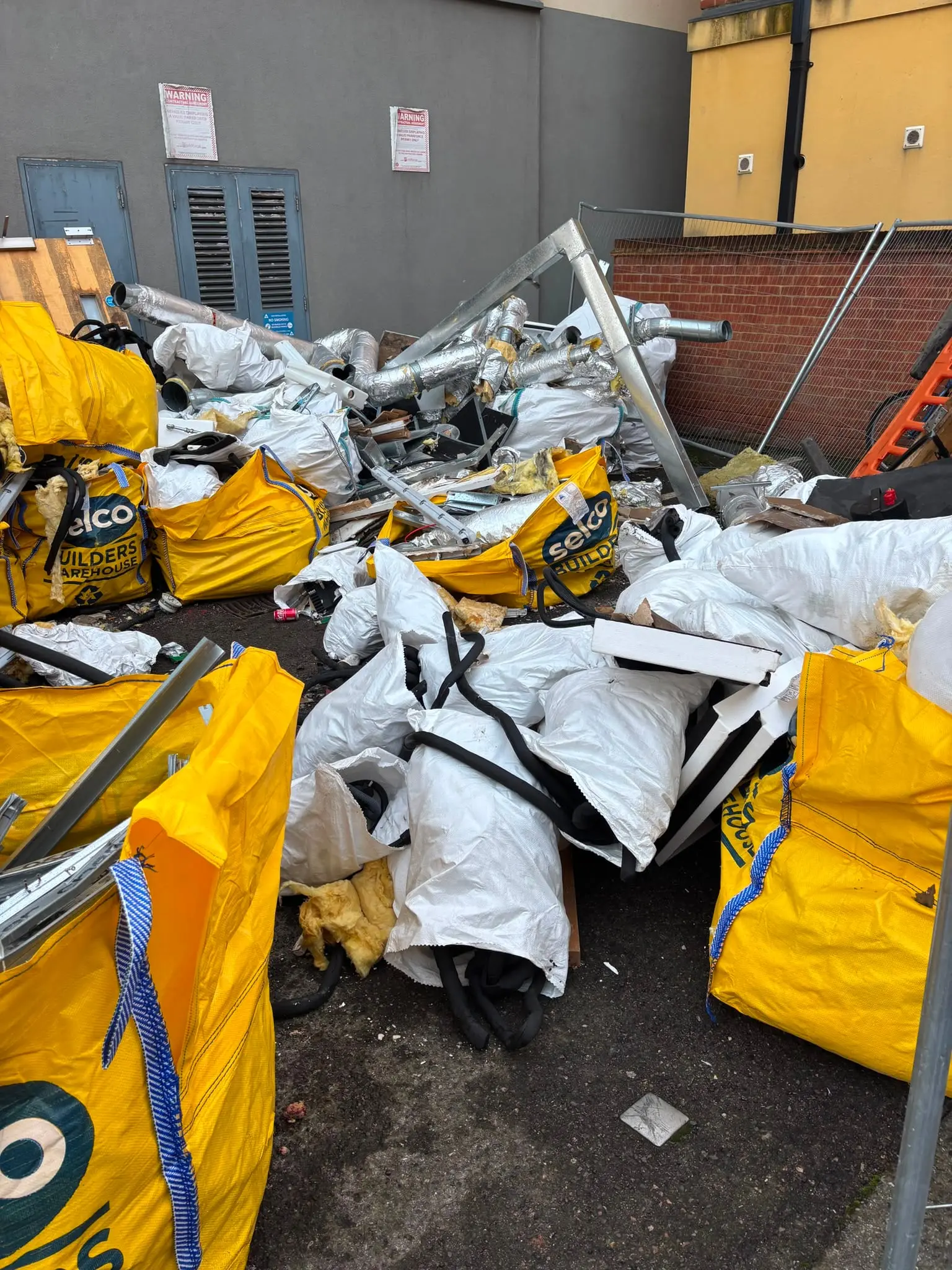 Bulk bags of commercial waste collected for clearance.